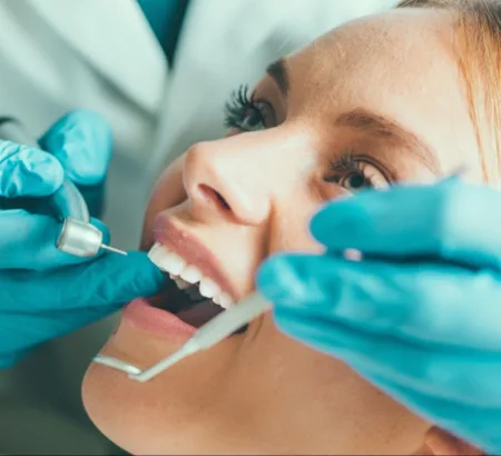 Orthodontist performing extraction therapy to a patient.