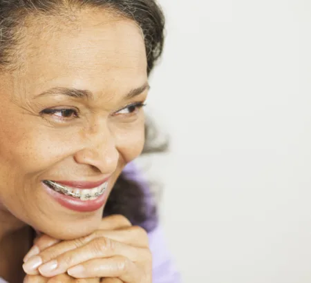 Senior patient wearing metal braces.