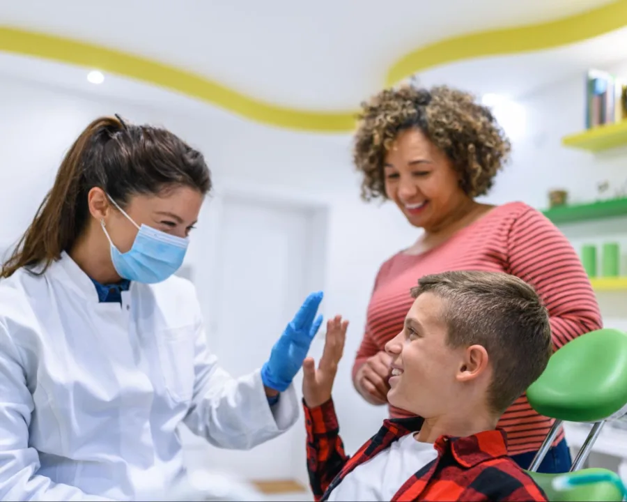 Patient high-fiving the orthodontist.