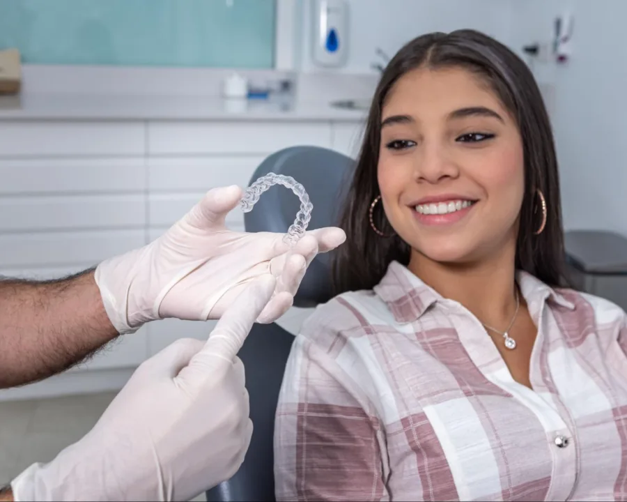 Orthodontist showing a patient their clear aligners.