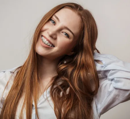 Woman smiling with clear ceramic braces