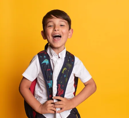 Child smiling undergoing myofunctional therapy